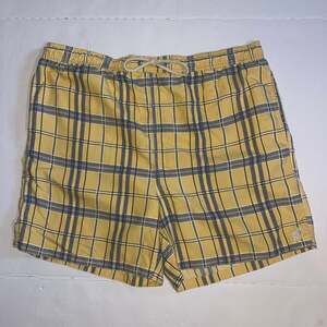 Caribbean Joe Island Supply Co. men's swim trunks in a yellow, black, and blue M